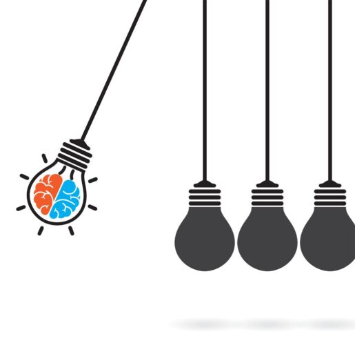 Image of swinging lightbulbs hitting one another.