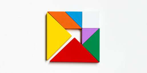 Multi color shapes coming together like a puzzle.