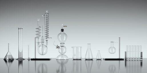 Image of various scientific test tubes and equipment lined up next to one another.