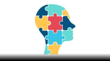 Profile view of a head using puzzle pieces.