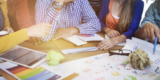 Picture of individuals working together on a project.