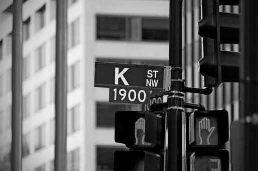 Black and white image of a sign of K St NW in Washington, D.C.
