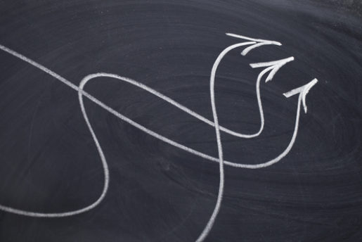 Arrows on a blackboard going different directions