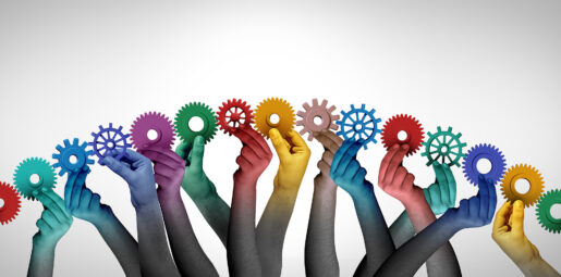 Hands in an arc hold different colored gears together to see if they fit.