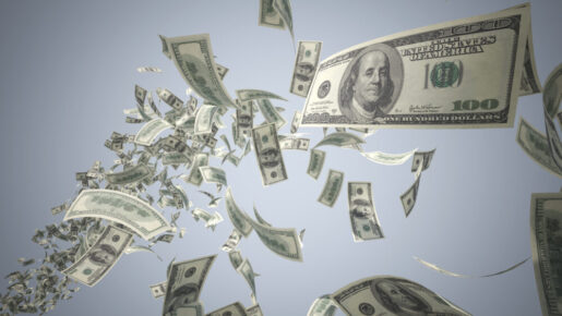 Banknotes fall from the sky.