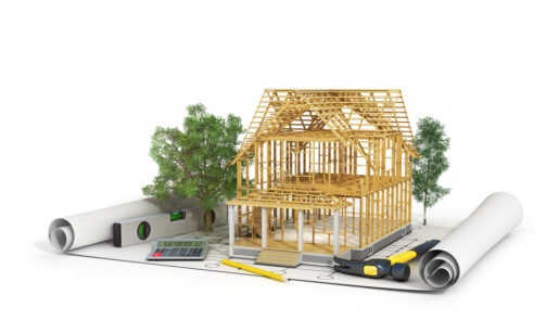 Draftsman's plans show an architectural rendering, trees, and a small house made up of popsicle sticks.