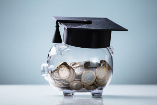 Piggy bank with a grad cap on it.